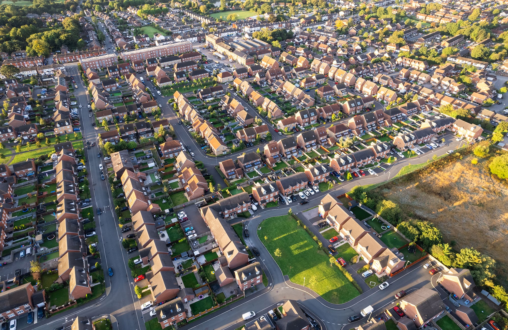 Aerial view of residential housing at sunset